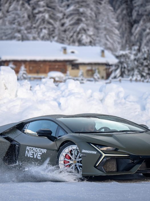 A Lamborghini sliding across snow at Lamborghini Accademia Neve in Livigno