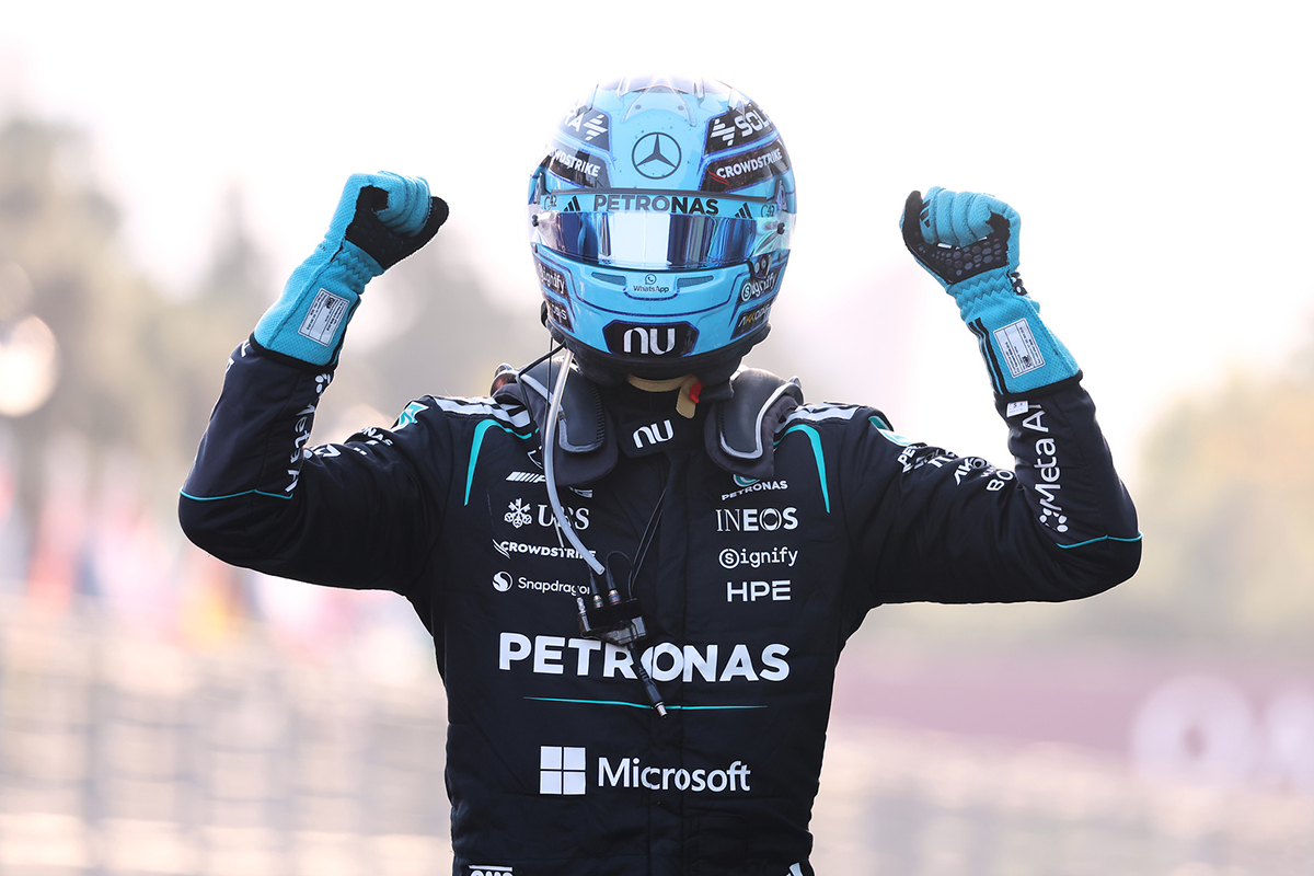 George Russell celebrating on the podium at the Baku City Circuit