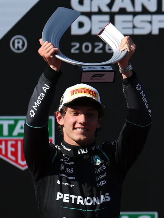Kimi Antonelli lifts the winner’s trophy at the Spanish Grand Prix