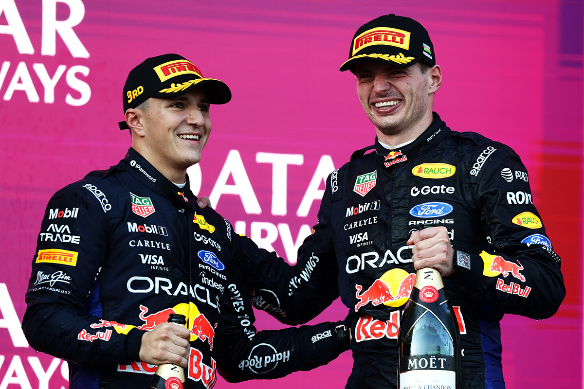 Max Verstappen and Isack Hadjar celebrating on the Baku podium