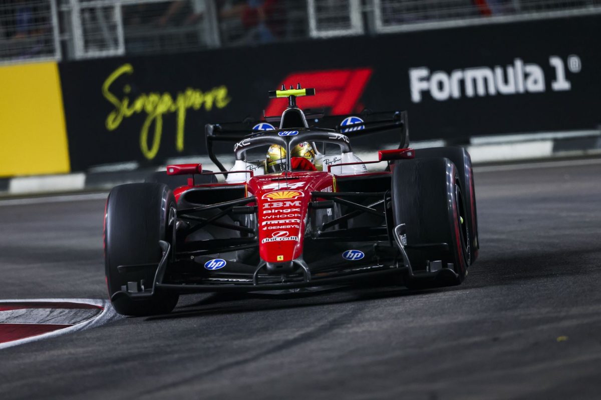 Lewis Hamilton’s Ferrari on track at night at Marina Bay