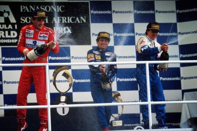 Ayrton Senna, Alain Prost and Mark Blundell spraying champagne on the 1993 South African Grand Prix podium