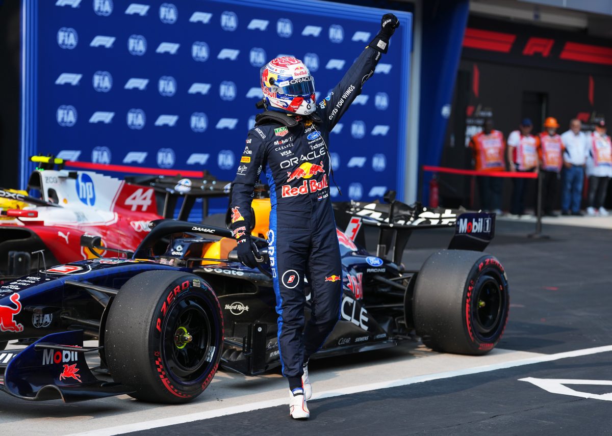Max Verstappen celebrating on his Red Bull in parc ferme after taking pole