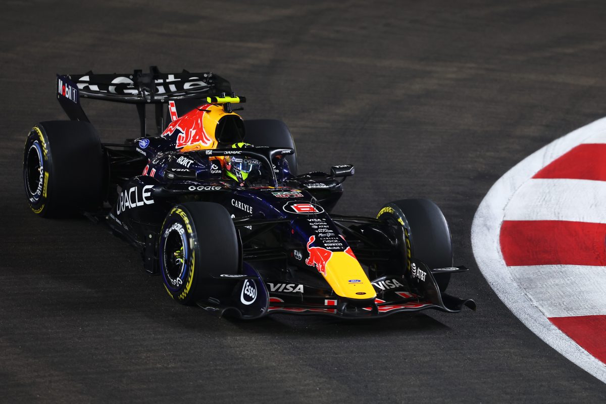 Isack Hadjar’s Red Bull on track at night