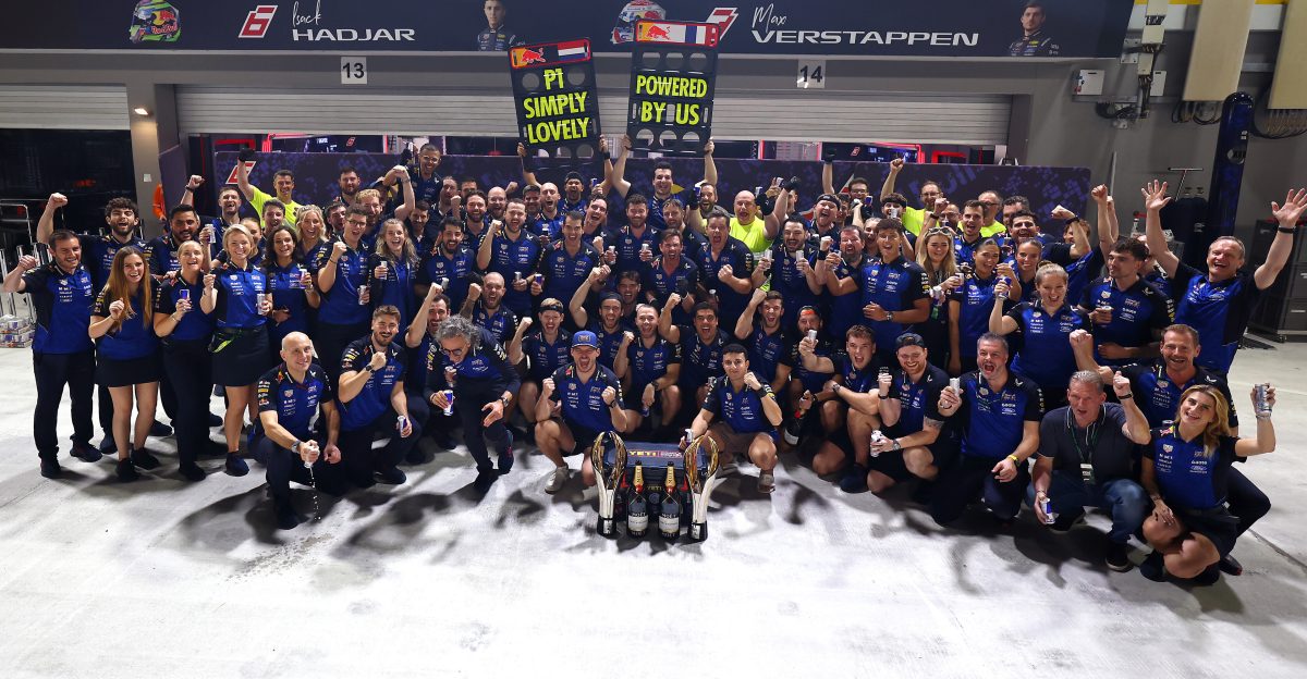 Max Verstappen celebrating with the Red Bull team in front of the garage