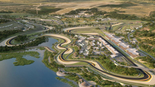 Aerial render of a winding racing circuit beside a lake, with grandstands and green hills