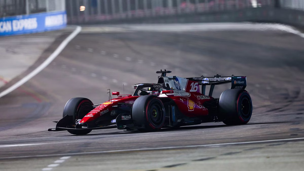 Charles Leclerc’s number 16 Ferrari on track at night during qualifying