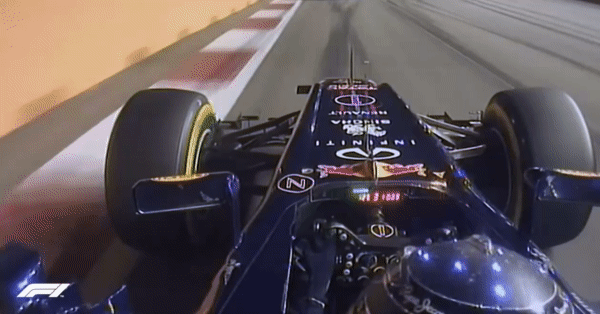 Onboard view of Sebastian Vettel’s Red Bull at night in Singapore, his LED helmet lit up in the cockpit